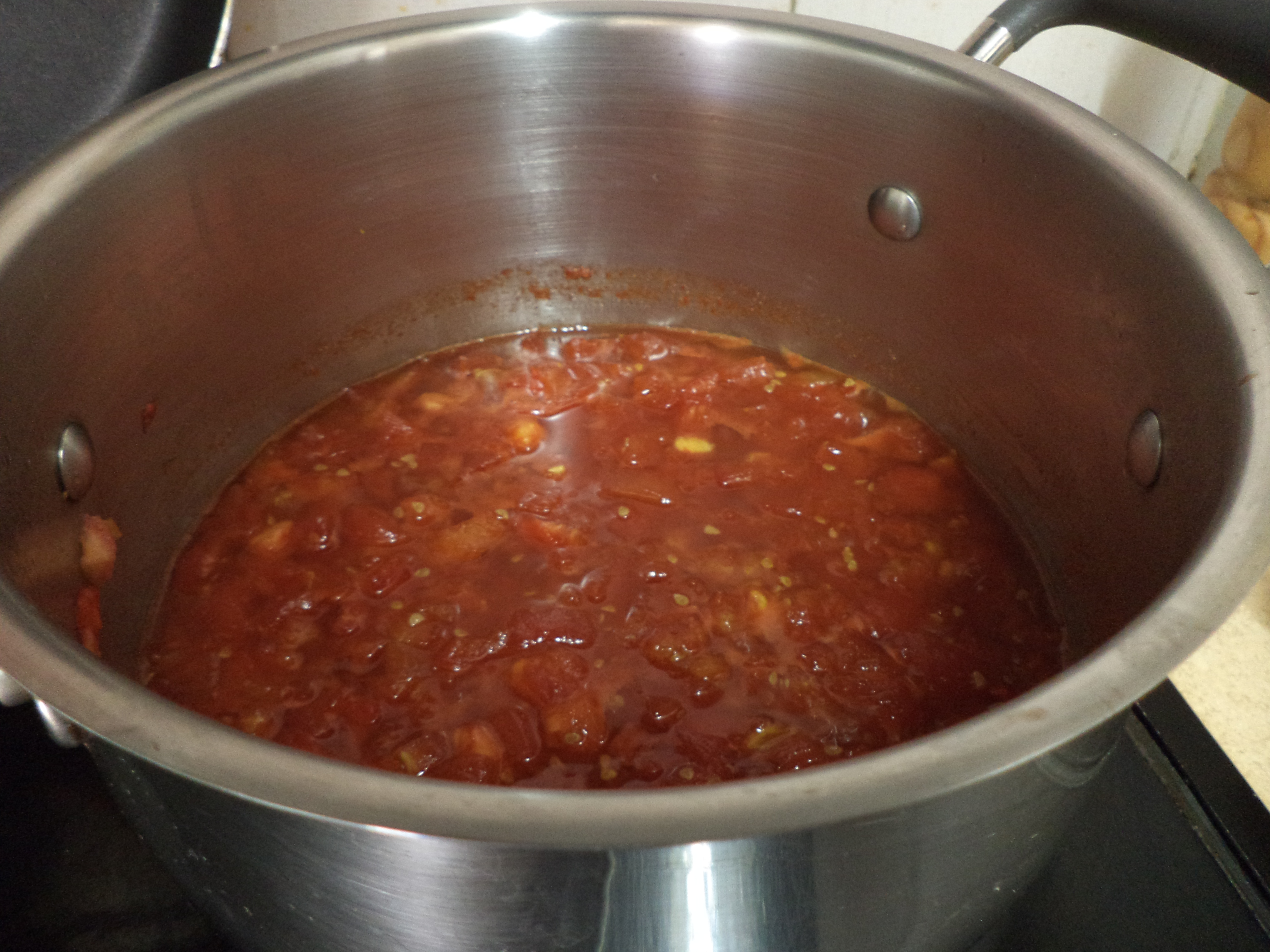 Tomato jam cooking on the stove